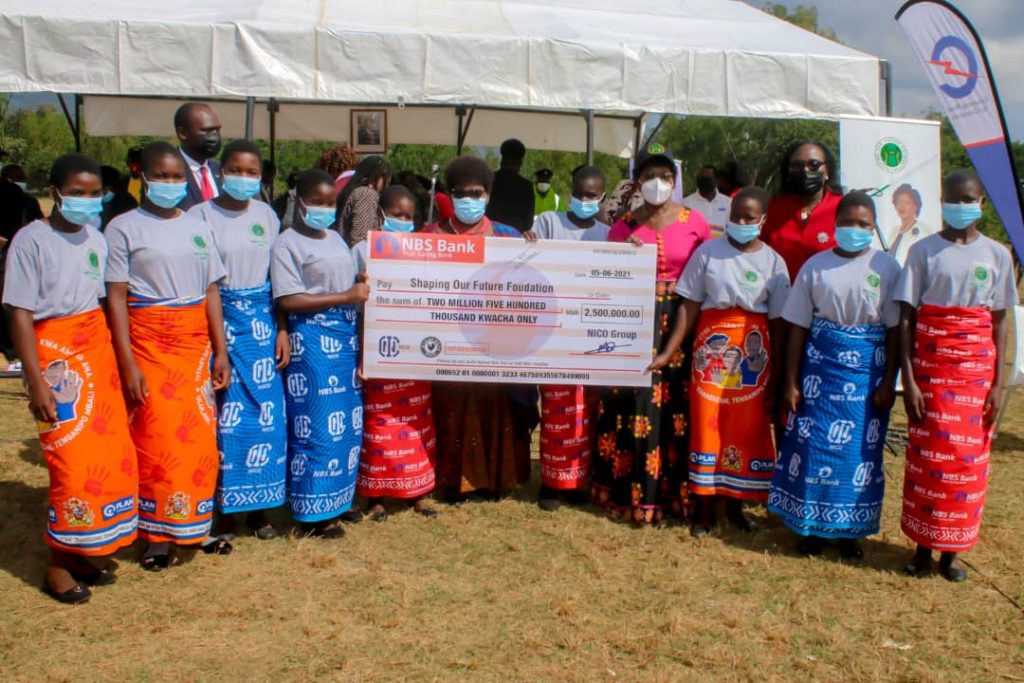 The beneficiaries under the mentorship program in Phalombe pose for a picture with Minister of Education, Hon. Agnes NyaLonje, MP for Phalombe South Constituency, Hon. Mary Mpanga, Acting Executive Director, SOFF, Mr. MacDuff Phiri and NBS Bank Chief Finance Officer, Mrs. Vera Zulu