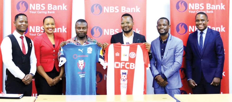 DRESSED TO KILL—Bullets Media Manager Kimpho Loka (second right), Palemeza (centre) show off their uniform as Longwe (second left), Zakazaka (right) and Matola look on