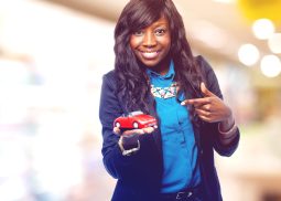 cool black woman with red car
