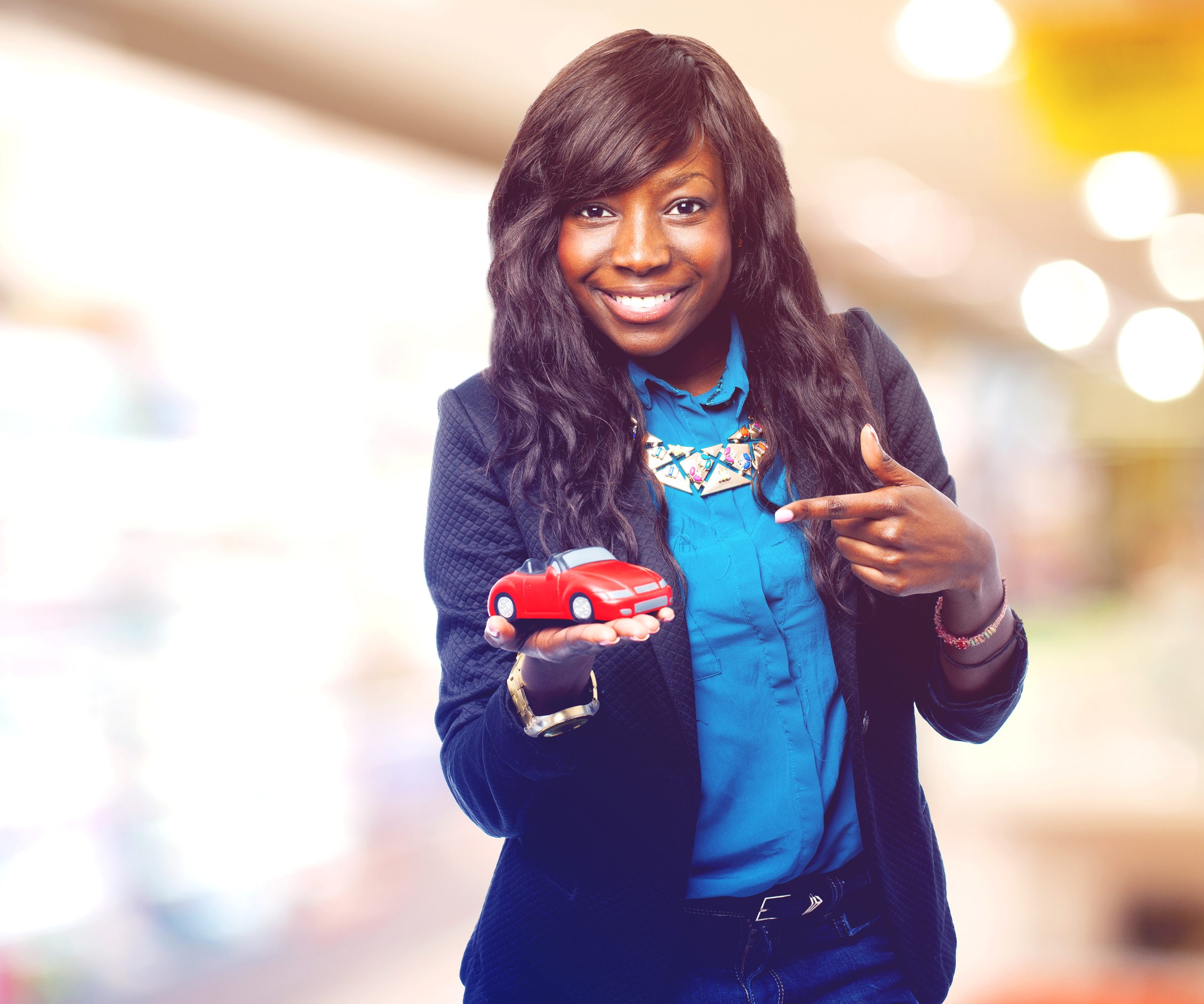 cool black woman with red car